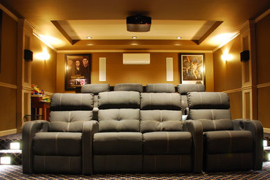 Mid-sized trendy enclosed carpeted home theater photo in Bridgeport with a wall-mounted tv and brown walls