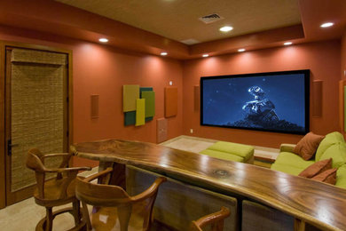 Large contemporary enclosed home cinema in Hawaii with orange walls, carpet and a projector screen.
