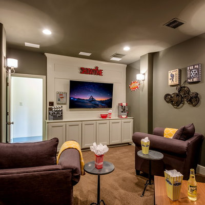 Elegant enclosed carpeted and brown floor home theater photo in Austin with gray walls and a wall-mounted tv