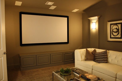 Mid-sized trendy enclosed carpeted and brown floor home theater photo in Houston with brown walls and a projector screen