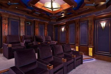 Photo of a large traditional enclosed home cinema in Vancouver with purple walls, carpet, a projector screen and purple floors.