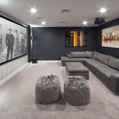 Mid-sized transitional enclosed carpeted and gray floor home theater photo in Orlando with black walls and a projector screen