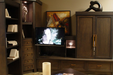 Example of an arts and crafts home theater design in Calgary with beige walls