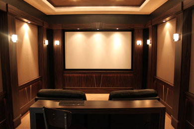 Example of a large transitional enclosed carpeted and beige floor home theater design in Detroit with brown walls and a projector screen