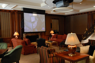 Example of a mid-sized enclosed carpeted home theater design in Los Angeles with multicolored walls and a projector screen