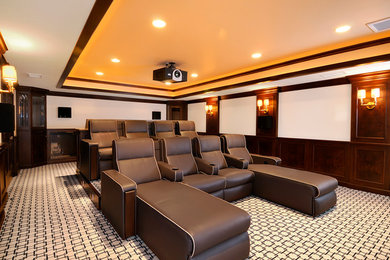 Large minimalist enclosed carpeted and multicolored floor home theater photo in San Diego with multicolored walls and a projector screen