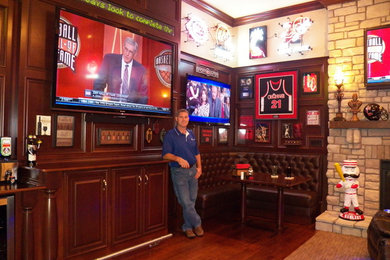 Home theater - large traditional enclosed home theater idea in Cincinnati with a wall-mounted tv