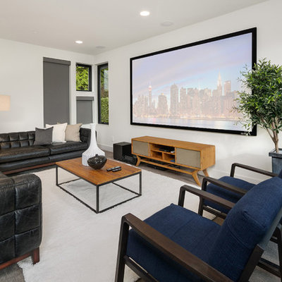 Mid-sized trendy enclosed carpeted and gray floor home theater photo in Seattle with white walls and a projector screen