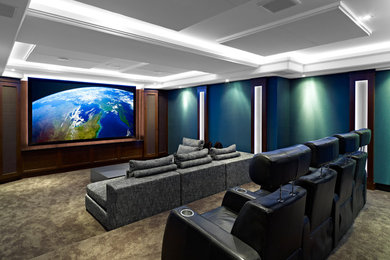 Design ideas for a traditional home cinema in Edmonton with a projector screen.