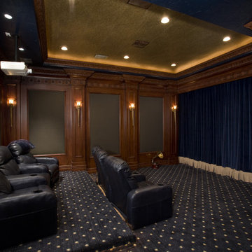 Theater with motorized drapery over screen
