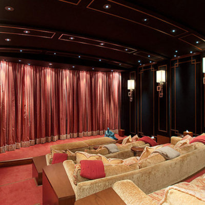 Home theater - huge traditional enclosed carpeted and red floor home theater idea in Vancouver with black walls and a projector screen