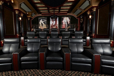 Home theater - mid-sized traditional open concept carpeted and black floor home theater idea in Miami with black walls and a projector screen