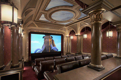 Example of a large minimalist enclosed carpeted and red floor home theater design in Los Angeles with red walls and a projector screen