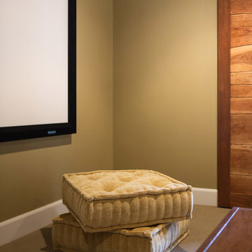 View of Floor Pillows with Wood Barn Doors and Projector Screen
