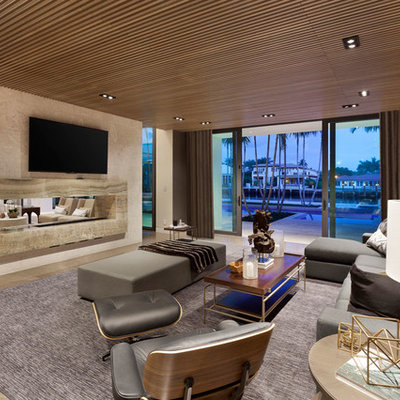 Home theater - large modern marble floor home theater idea in Miami