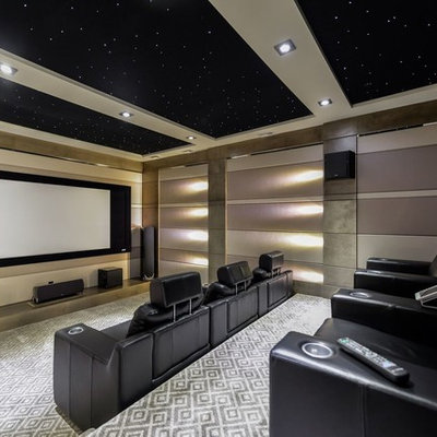 Inspiration for a large transitional enclosed carpeted and multicolored floor home theater remodel in Calgary with beige walls and a projector screen