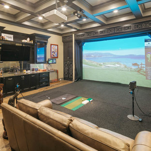 Home theater - large transitional open concept light wood floor and beige floor home theater idea in Houston with beige walls and a projector screen