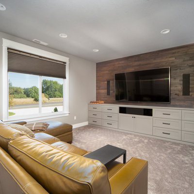 Inspiration for a large transitional enclosed carpeted and gray floor home theater remodel in Portland with gray walls and a wall-mounted tv