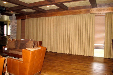 Home theater - rustic home theater idea in Charlotte