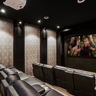 Inspiration for a large contemporary home theatre in Central Coast with black walls, carpet, a projector screen and beige floor.