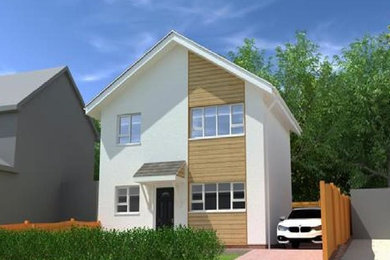 Design ideas for a medium sized contemporary house exterior in Sussex.