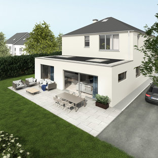 Zweistöckiges, Weißes, Schwarzes Modernes Einfamilienhaus mit Putzfassade, Flachdach und Misch-Dachdeckung in Cork