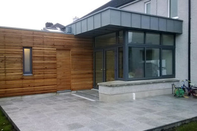 Inspiration for a contemporary house exterior in Cork with a flat roof.