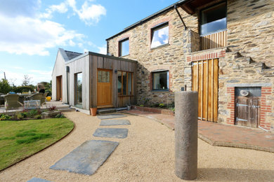 Inspiration for a medium sized contemporary two floor detached house in Devon with mixed cladding.