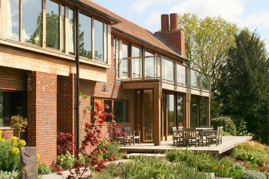 Inspiration for a red two floor brick house exterior in Hampshire.