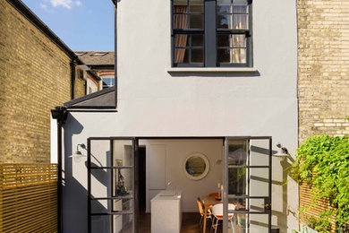 Photo of a white traditional two floor house exterior in London.