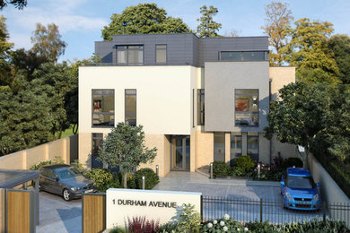 Design ideas for a large and white contemporary render house exterior in Kent with three floors and a flat roof.