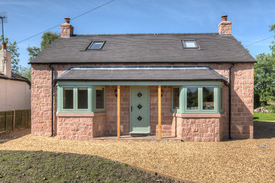 This is an example of a medium sized classic house exterior in West Midlands.