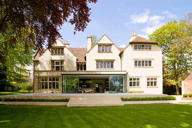 This is an example of a white classic house exterior in Oxfordshire with three floors.