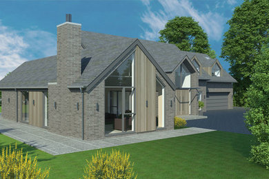 Foto de fachada de casa marrón contemporánea de tamaño medio de dos plantas con revestimientos combinados, tejado a dos aguas y tejado de teja de barro