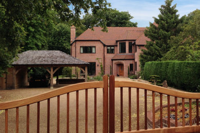 Large modern detached house in Kent with a tiled roof and three floors.