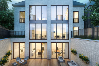 Foto de fachada blanca contemporánea de tamaño medio de tres plantas con revestimiento de ladrillo y tejado a doble faldón