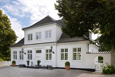 Large and white traditional two floor house exterior in Copenhagen.