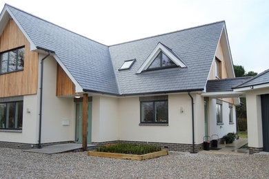 Inspiration for a contemporary two floor detached house in Kent with mixed cladding.