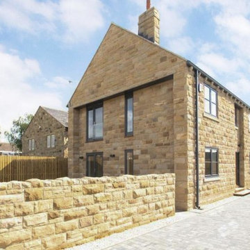 Contemporary newbuild stone house in conservation area