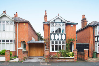 Design ideas for a traditional house exterior in Surrey.