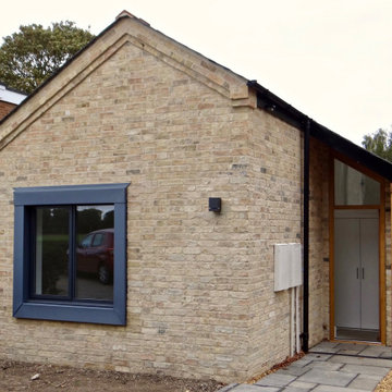 Contextural brick extensions to Cambridge Townhouse & newbuild Annex