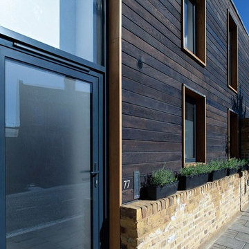 Contrasting Charred Cedar shousugiban cladding of a London town house in Hackney