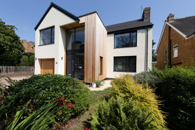 Inspiration for a contemporary detached house in Other with wood cladding.