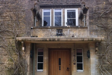 Photo of a rural two floor house exterior in Oxfordshire with stone cladding.