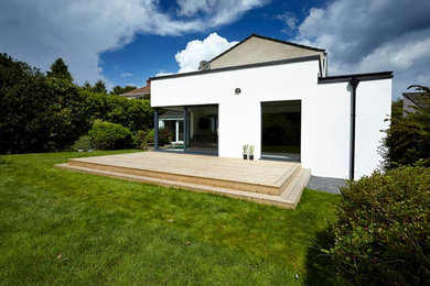 Photo of a white contemporary two floor extension in Belfast.