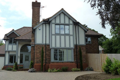 Design ideas for a classic house exterior in Surrey.