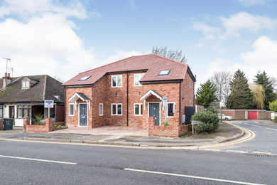 This is an example of a modern two floor semi-detached house in London with a pitched roof.