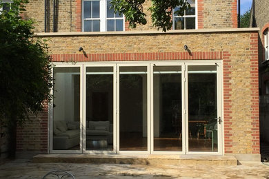 Design ideas for a medium sized contemporary house exterior in London.