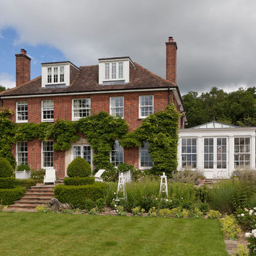 Elegant Georgian orangery with separate side entrance adjoining the home.
