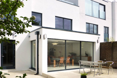 Design ideas for a white contemporary render house exterior in London.